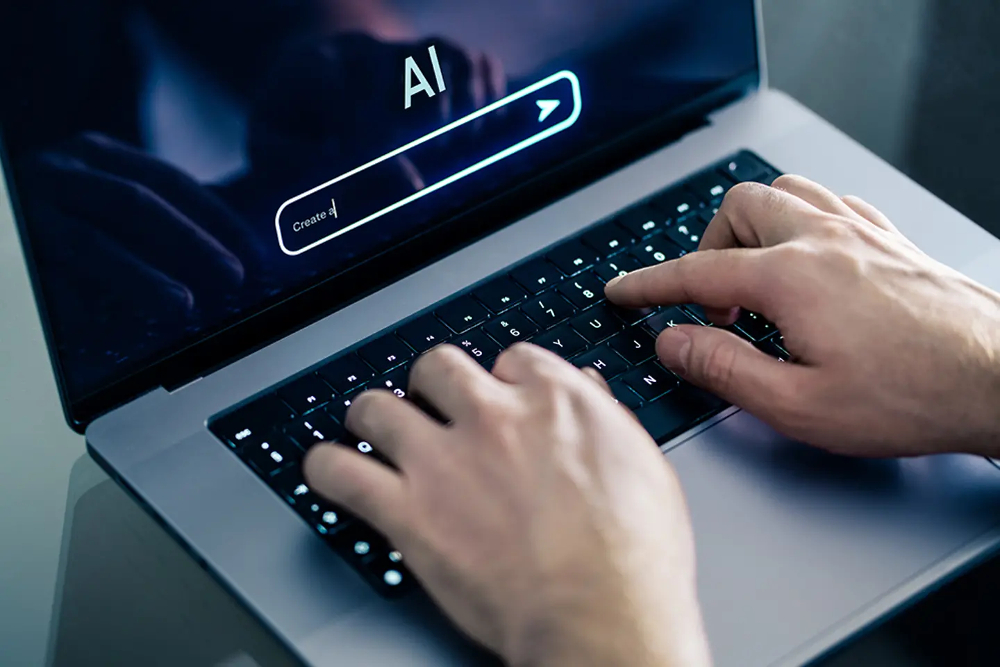A man using chatbot with laptop at work