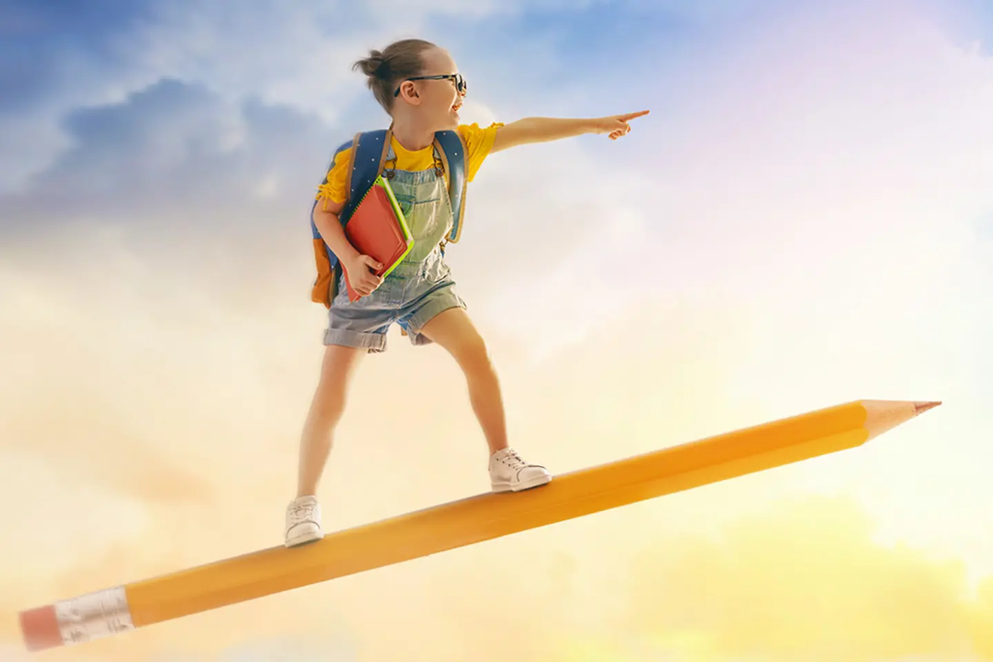 A schoolgirl flies through the clouds on an oversized pencil