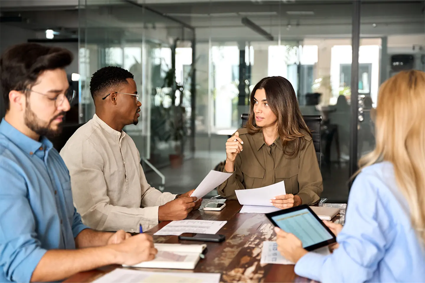 Diverse people in a business team at an official meeting