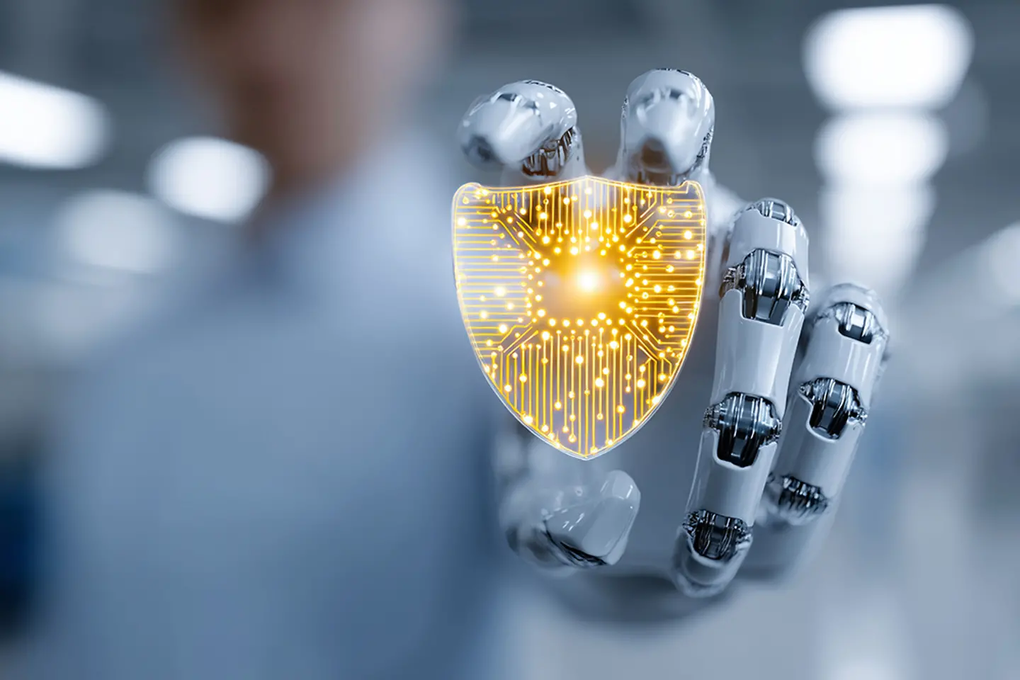 A conceptual business image of a high-tech microchip held by a robotic hand, glowing with golden data pathways.