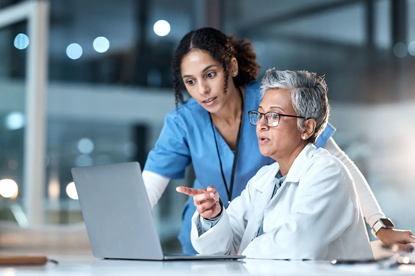 Doctors, nurse or laptop in night healthcare, planning research or surgery teamwork in wellness hospital.