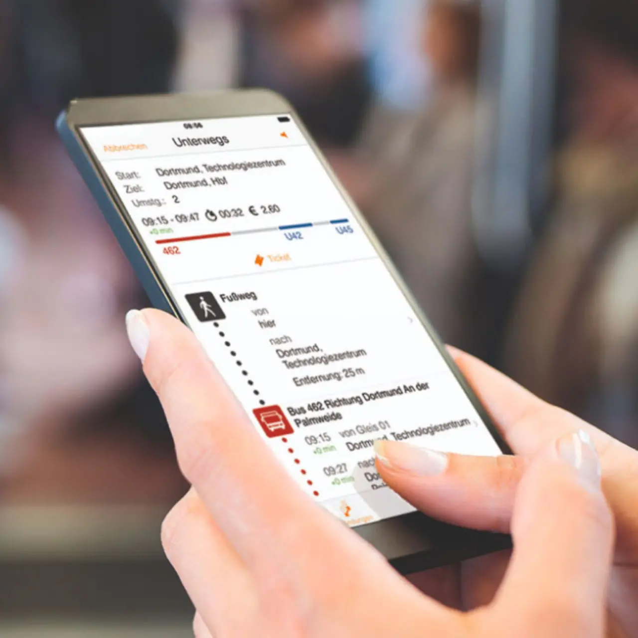 A woman looks at her personal travel schedule on her smartphone